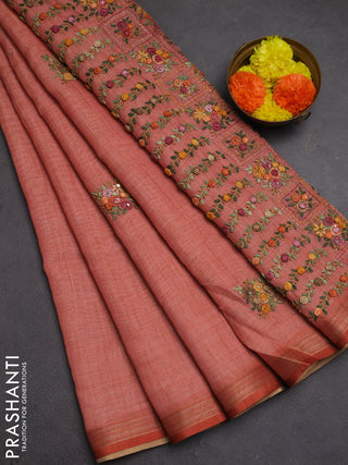Tissue linen saree peach shade with embroidery buttas and embroidery pallu