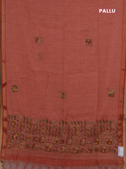Tissue linen saree peach shade with embroidery buttas and embroidery pallu