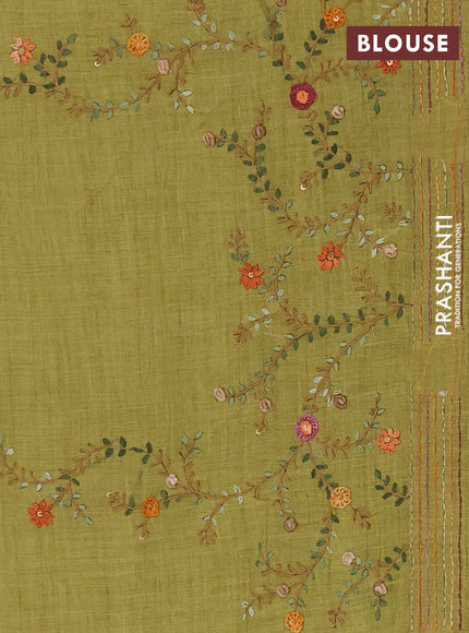 Tissue linen saree light green with embroidery buttas and embroidery pallu