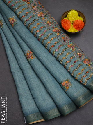 Tissue linen saree teal blue with embroidery buttas and embroidery pallu