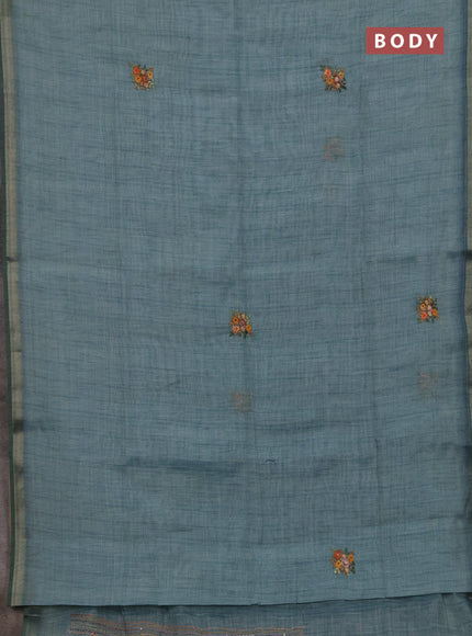 Tissue linen saree teal blue with embroidery buttas and embroidery pallu
