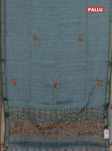 Tissue linen saree teal blue with embroidery buttas and embroidery pallu