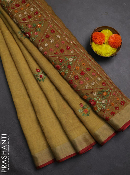 Tissue linen saree mustard green and maroon with embroidery buttas and embroidery pallu