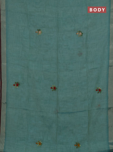 Tissue linen saree teal blue and maroon with embroidery buttas and embroidery pallu