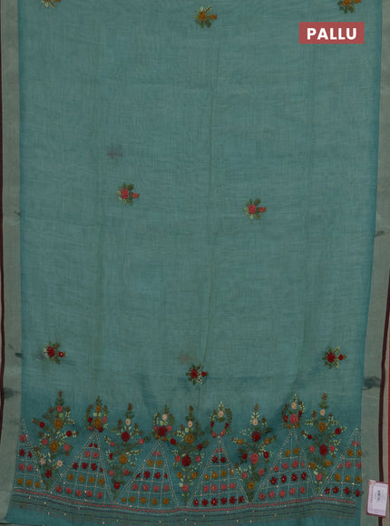 Tissue linen saree teal blue and maroon with embroidery buttas and embroidery pallu