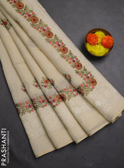 Tissue linen saree cream and rust shade with embroidery buttas and embroidery border