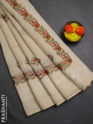 Tissue linen saree cream and rust shade with embroidery buttas and embroidery border