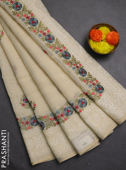 Tissue linen saree cream and grey with embroidery buttas and embroidery border