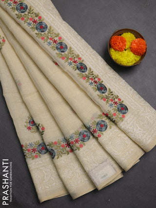Tissue linen saree cream and grey with embroidery buttas and embroidery border