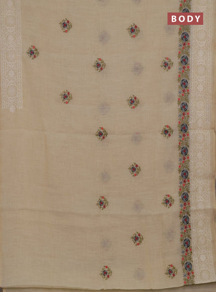 Tissue linen saree cream and grey with embroidery buttas and embroidery border