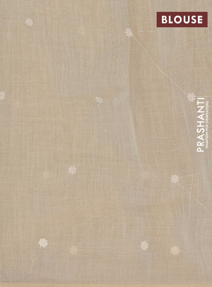 Tissue linen saree cream and grey with embroidery buttas and embroidery border