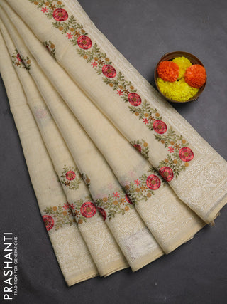 Tissue linen saree cream and peach shade with embroidery buttas and embroidery border