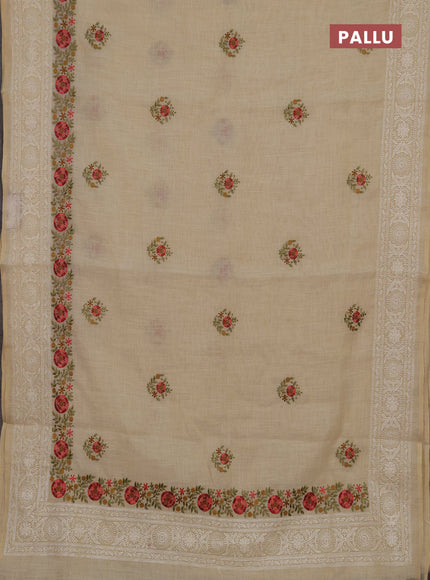 Tissue linen saree cream and peach shade with embroidery buttas and embroidery border