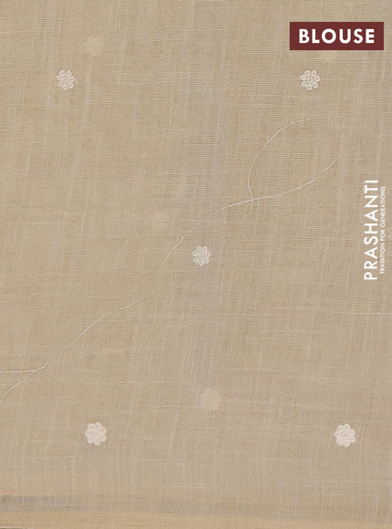 Tissue linen saree cream and peach shade with embroidery buttas and embroidery border