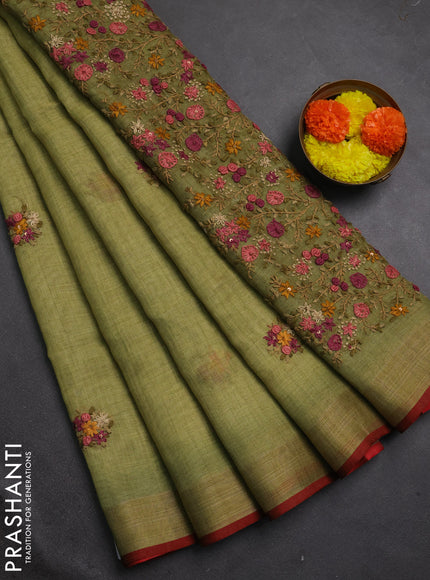 Linen cotton saree light green with embroidery buttas and embroidery pallu