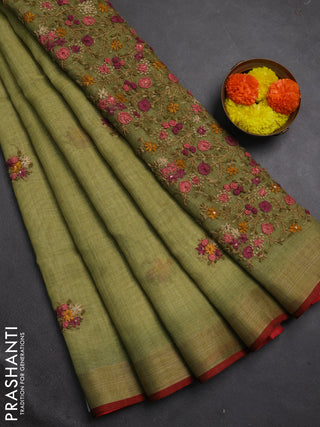 Linen cotton saree light green with embroidery buttas and embroidery pallu