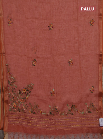 Linen cotton saree peach shade with embroidery buttas and embroidery pallu