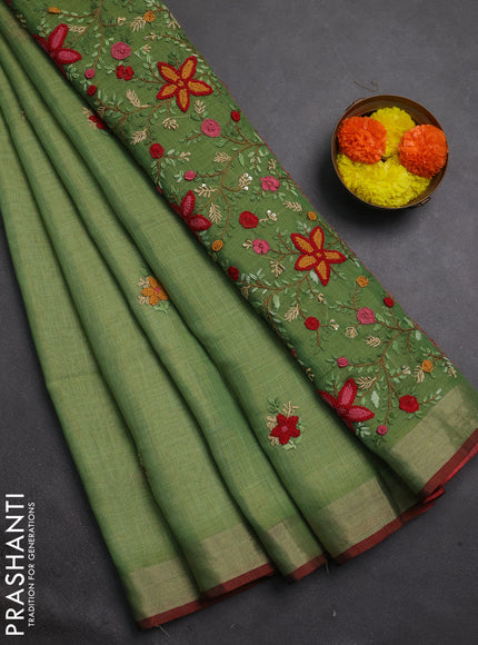 Linen cotton saree green with embroidery buttas and embroidery pallu