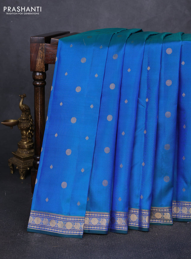 Pure kanchipuram silk saree dual shade of bluish green with allover zari woven geometric buttas and zari woven border