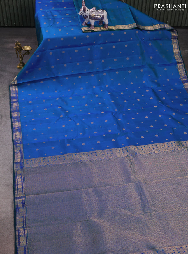 Pure kanchipuram silk saree dual shade of bluish green with allover zari woven geometric buttas and zari woven border