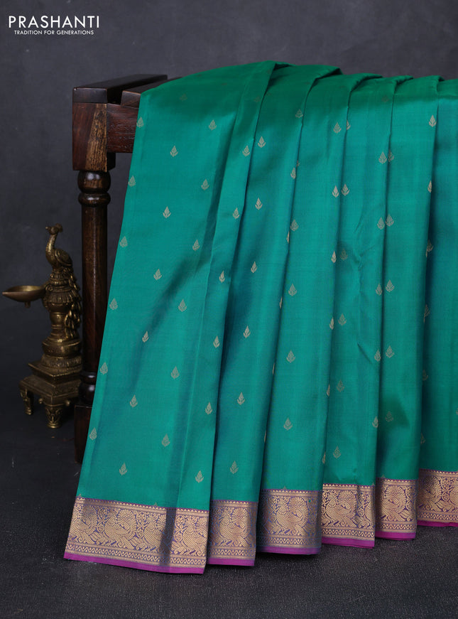 Pure kanchipuram silk saree teal green and purple with allover zari woven buttas and rich zari woven annam border