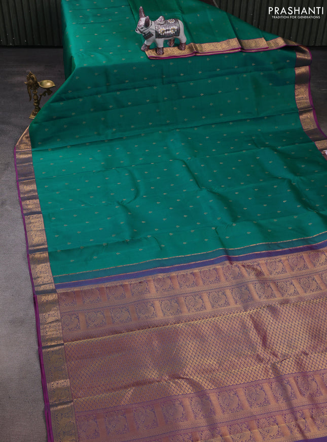 Pure kanchipuram silk saree teal green and purple with allover zari woven buttas and rich zari woven annam border