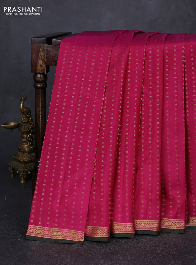 Pure kanchipuram silk saree dark magenta pink and bottle green with allover zari woven 1000 buttas and small zari woven border