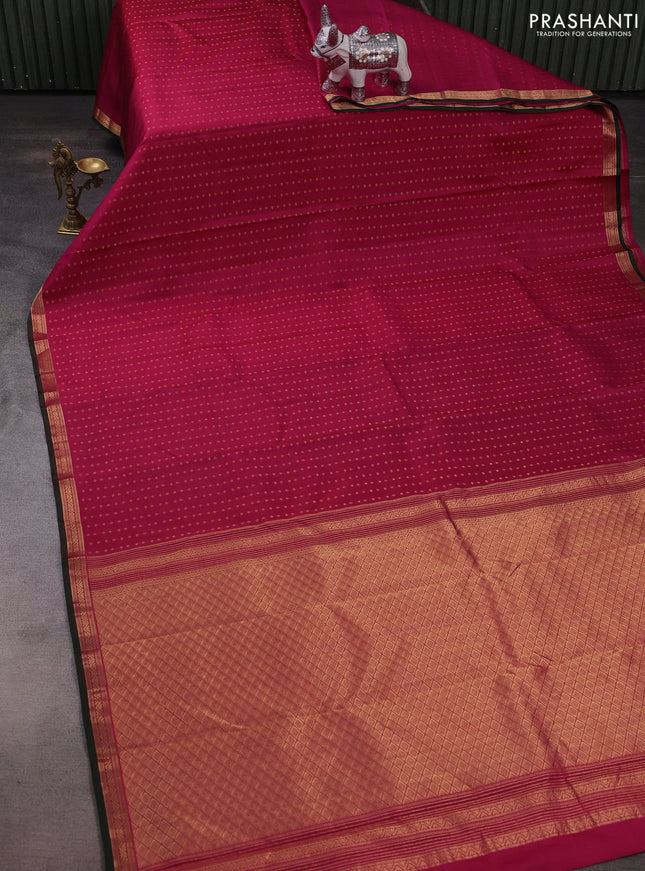 Pure kanchipuram silk saree dark magenta pink and bottle green with allover zari woven 1000 buttas and small zari woven border