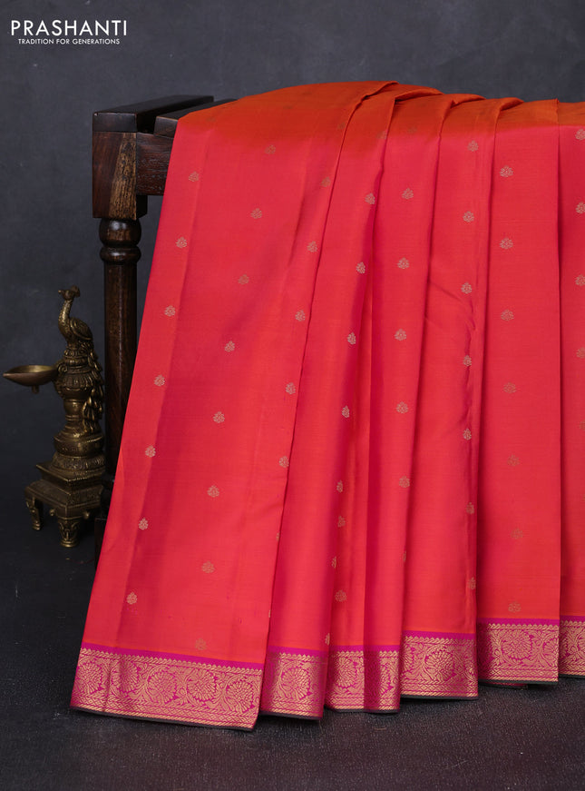 Pure kanchipuram silk saree dual shade of pinkish orange and pink with allover zari woven buttas and rich zari woven border