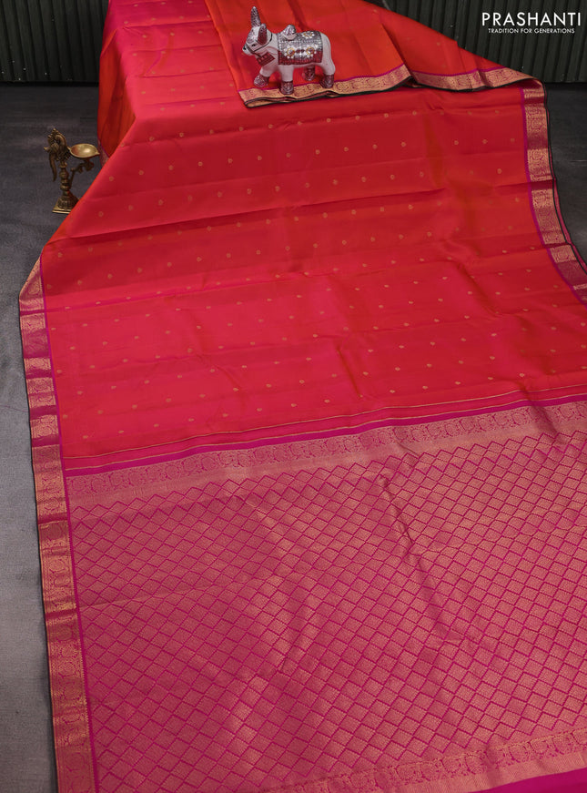 Pure kanchipuram silk saree dual shade of pinkish orange and pink with allover zari woven buttas and rich zari woven border