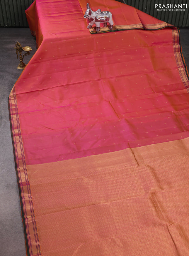 Pure kanchipuram silk saree dual shade of pinkish yellow and bottle green with allover zari woven buttas and zari woven border