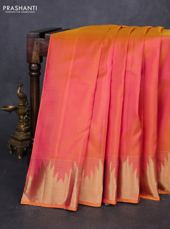 Pure kanchipuram silk saree dual shade of pinkish yellow with plain body and temple design zari woven border