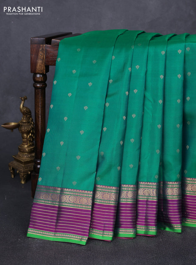 Pure kanchipuram silk saree dual shade of teal green and purple with allover zari woven buttas and zari woven border