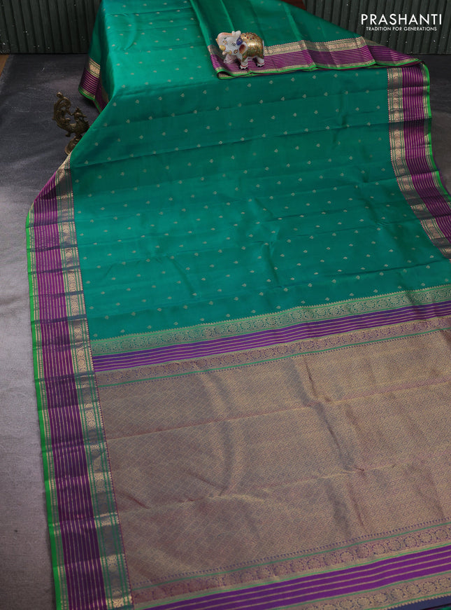 Pure kanchipuram silk saree dual shade of teal green and purple with allover zari woven buttas and zari woven border