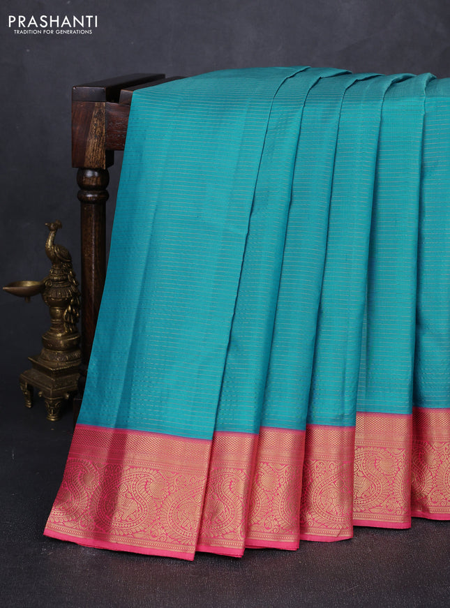 Pure kanchipuram silk saree teal blue and peach pink with allover zari stripe pattern and rich zari woven border