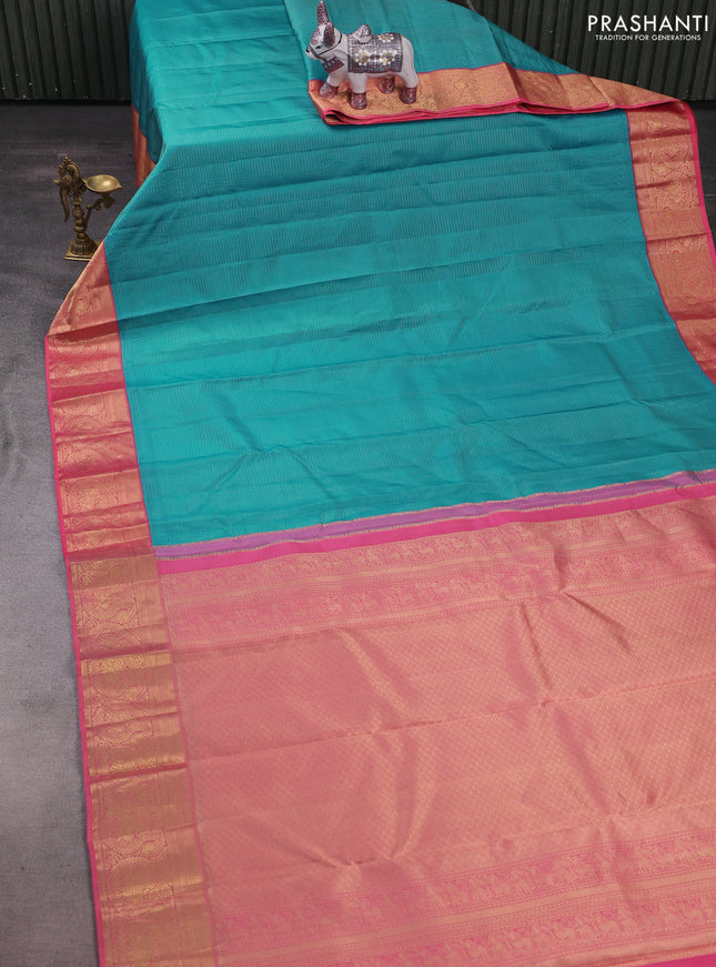Pure kanchipuram silk saree teal blue and peach pink with allover zari stripe pattern and rich zari woven border