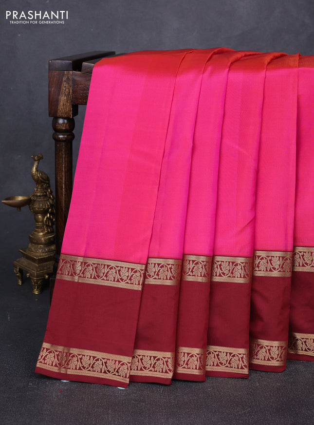 Pure kanchipuram silk saree dual shade of pinkish orange and maroon with plain body and long rettapet zari woven border
