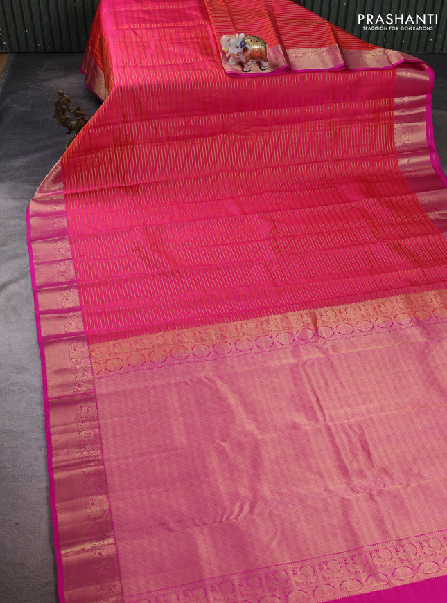 Pure kanchipuram silk saree dual shade of orange and pink with allover zari stripe pattern and rich zari woven border
