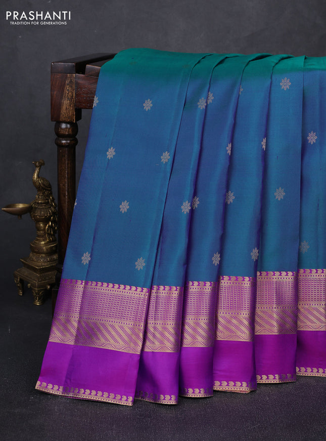 Pure kanchipuram silk saree dual shade of bluish green and purple with zari woven buttas and long rettapet zari woven border