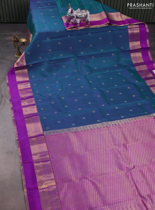 Pure kanchipuram silk saree dual shade of bluish green and purple with zari woven buttas and long rettapet zari woven border