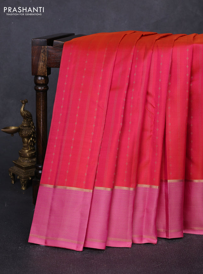 Pure kanchipuram silk saree dual shade of pinkish orange and peach pink with allover zari weaves and zari woven border