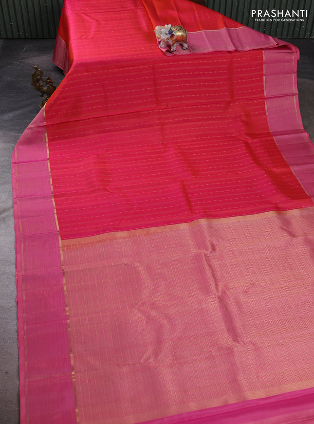 Pure kanchipuram silk saree dual shade of pinkish orange and peach pink with allover zari weaves and zari woven border
