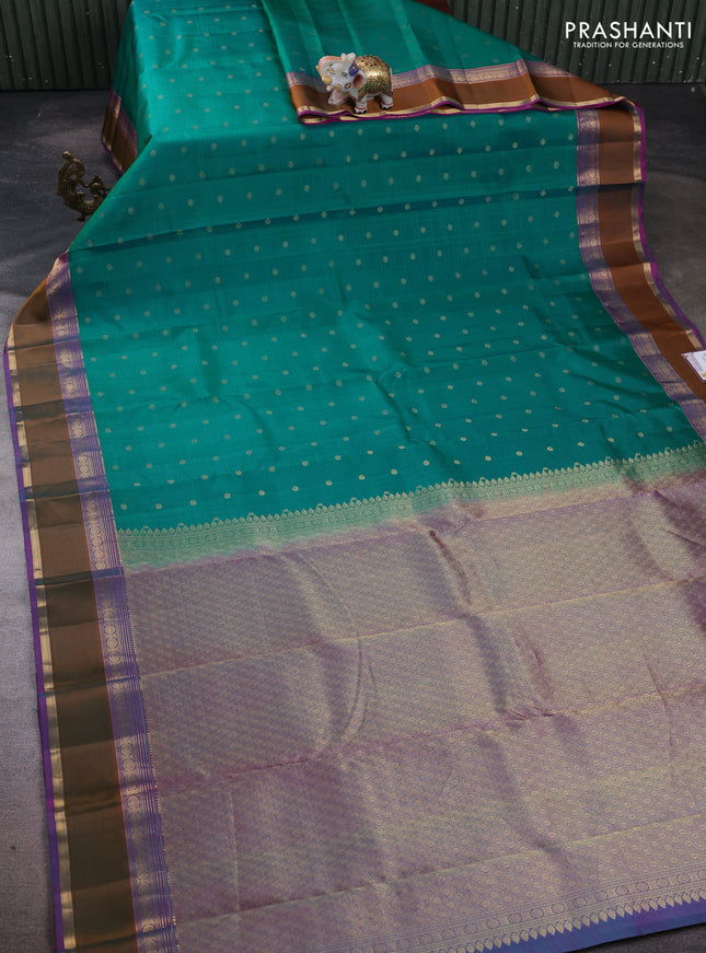 Pure kanchipuram silk saree teal green and purple with allover self emboss & zari buttas and rettapet zari woven border