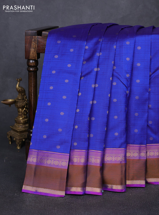 Pure kanchipuram silk saree blue and purple with allover self emboss & zari buttas and rettapet zari woven border