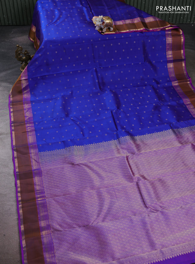 Pure kanchipuram silk saree blue and purple with allover self emboss & zari buttas and rettapet zari woven border