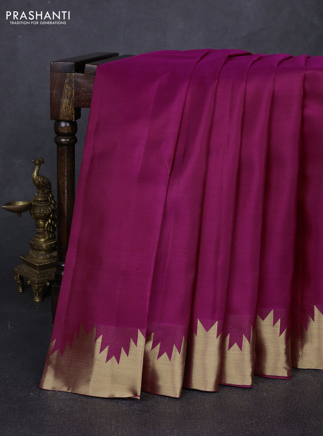 Pure kanchipuram silk saree magenta pink with plain body and temple design zari woven border