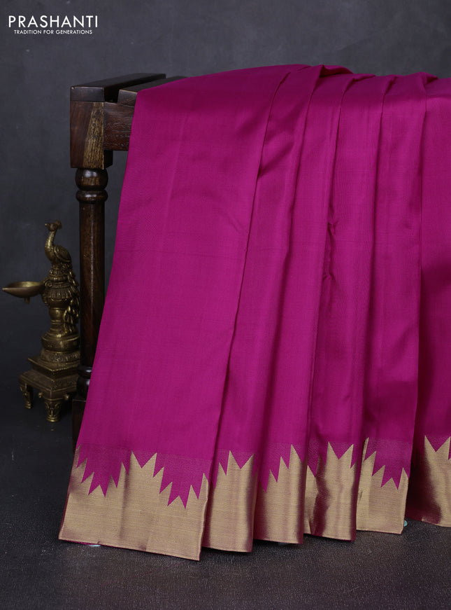 Pure kanchipuram silk saree pink with plain body and temple design zari woven border