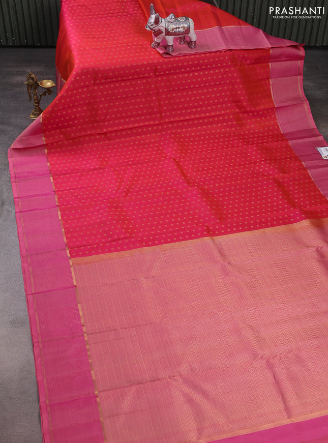 Pure kanchipuram silk saree dual shade of pinkish orange and light pink with allover zari woven 1000 buttas and zari woven border