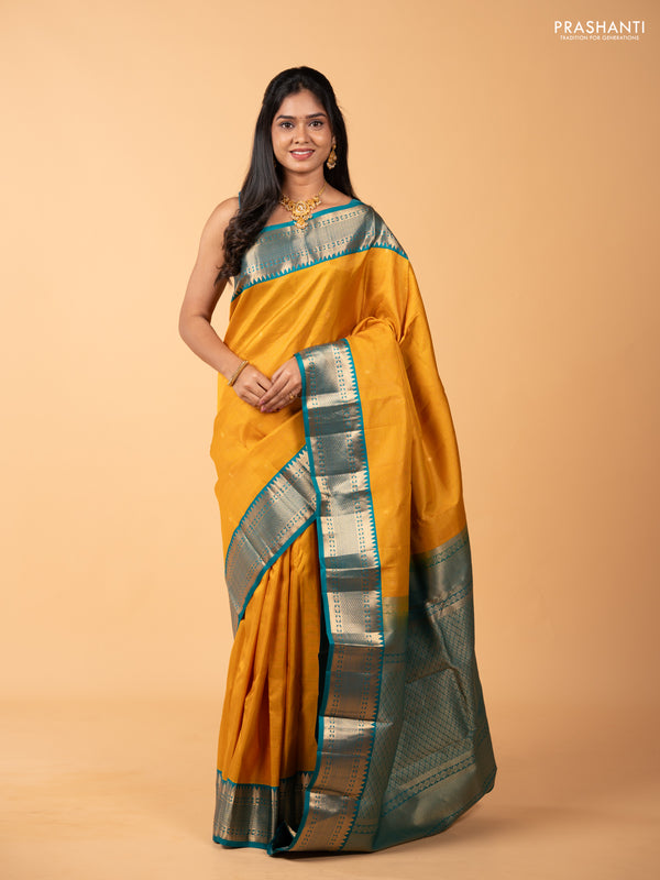 Pure kanchipuram silk saree mustard yellow and teal green shade with allover zari checks & buttas and rich zari woven korvai border