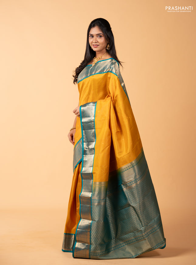 Pure kanchipuram silk saree mustard yellow and teal green shade with allover zari checks & buttas and rich zari woven korvai border